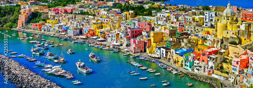 View of the Port of Corricella with lots of colorful houses on a sunny day in Procida Island, Italy.