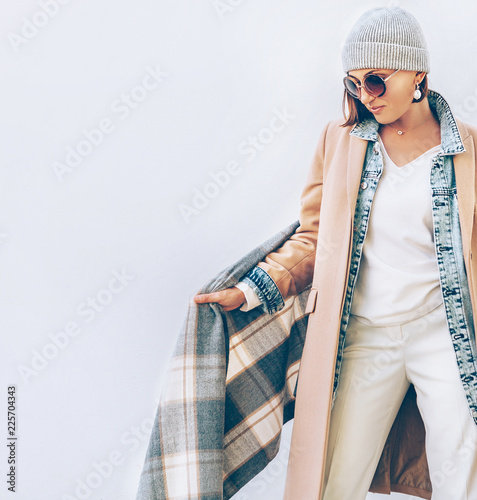 Young Woman dressed in multilayered autumn outfit