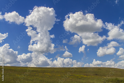 cumulus clouds in blue sky over the Flint Hills, Tallgrass Prairie National Preserve, Kansas