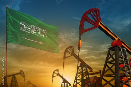 Saudi Arabia oil industry concept. Industrial illustration - Saudi Arabia flag and oil wells against the blue and yellow sunset sky background - 3D illustration