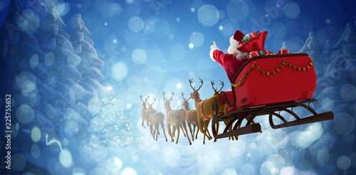 Composite image of santa claus riding on sleigh with gift box