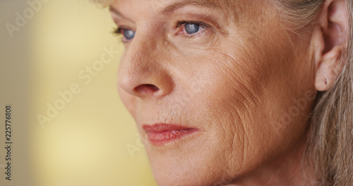 Beautiful mature woman looking away smiling