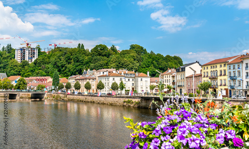 Flowers on a bridge across the Moselle River in Epinal, France