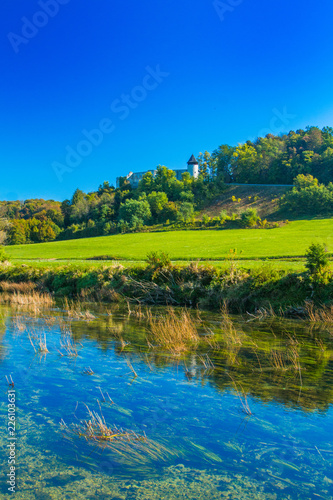 Croatia, valley of river Dobra and old fortress in Novigrad, green countryside landscape Karlovac county 