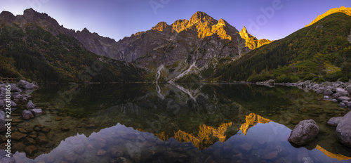 Panorama of a mountain lake during sunrise - Morskie Oko, Tatra Mountains, Poland