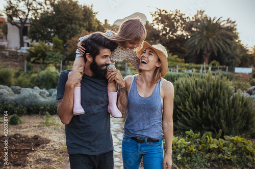 Cheerful family spending time together at farm