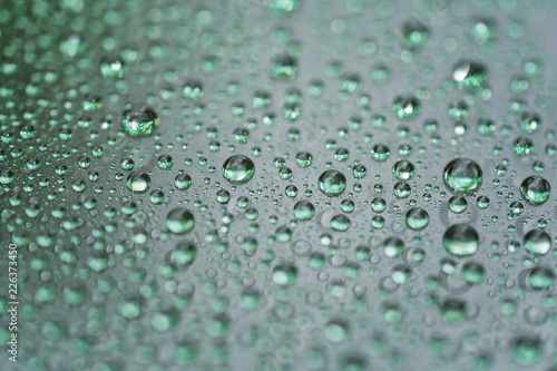 rain drops on car glass with hydrophobic coating macro photo