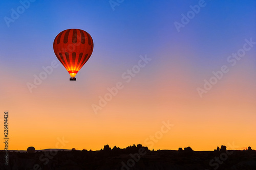 Hot air balloon in the sky during sunrise in Cappadocia