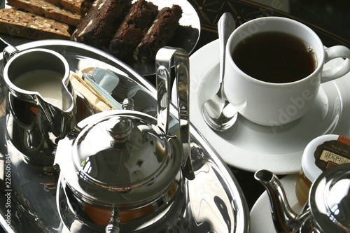 The Afternoon tea with lemon tea, honey, and walnut cookies. Afternoon Tea is a tea-related ritual, introduced in Britain in the early 1840s and is a meal composed of sweet pastries and cakes.