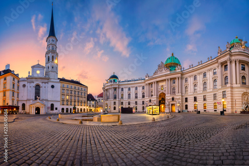 Vienna, Austria. Cityscape image of Vienna, Austria with St. Michael's Church and located at St. Michael Square during sunrise. 