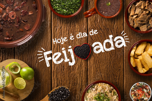 Brazilian Feijoada Food. Written "Today is Feijoada's Day" in Portuguese. Top view