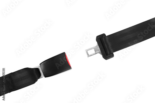 Open car safety seat belt on white background, top view
