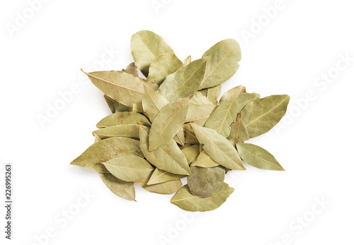 Dried bay leaves stack isolated on white.