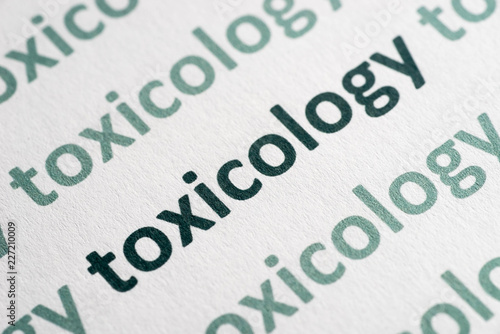 word toxicology printed on paper macro