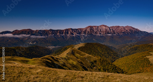 Bucegi mountains scene view from baiului mountains in Romania. Great hiking outdoor, amazing fog over the peak