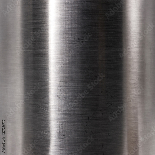 Brushed steel plate texture. Hard metal material background. Reflection surface.