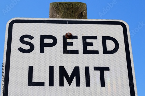 A view of the top of a speed limit sign on a close view.