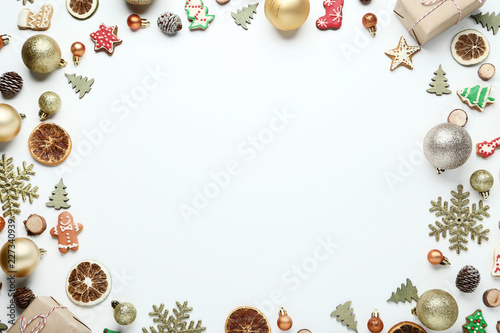 Christmas decorations with gingerbread cookies on white background