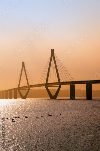 faro bridge in sunset light, the highway bridge over the Storstroem in denmark connects the islands and is a part of the vogelfluglinie (bird flight line), copy space