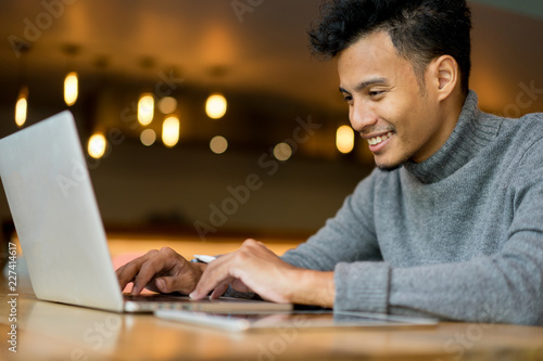 close up freelance man working on laptop at cafe , lifestyle concept