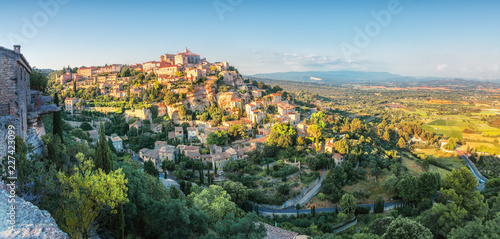 French medieval town in Provence - Gordes. Beautiful panoramic view on medieval town Gordes in sunset light.