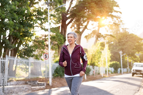 Active senior woman jogging