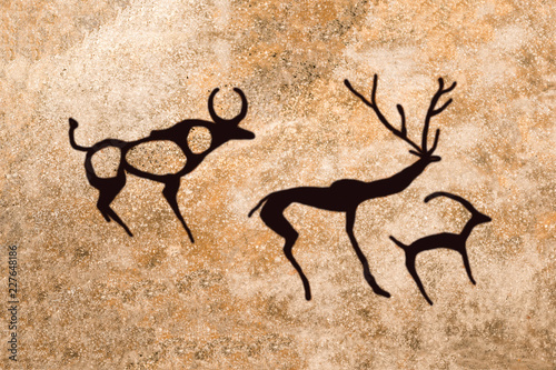 image of ancient animals painted on the wall of a cave by an ancient man. ancient history, archeology.