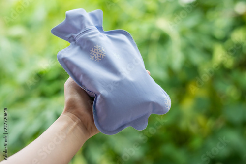 Close up woman has abdominal pain, woman's belly with hot water bottle,Close up woman use Hot Pack 