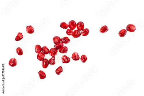 Seeds of pomegranate isolated on white background. Top view.