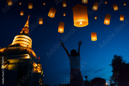 People floating lamp in Yi Peng festival in Chiangmai Thailand