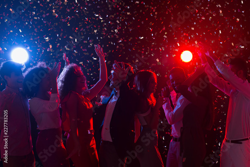 Young people dancing in night club at New Year party