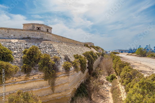 Marsaxlokk, Malta. The fortress wall and dry moat of the British Fort Delimar, 1876 - 1888