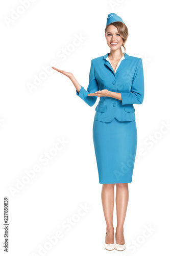 Portrait of charming stewardess wearing in blue uniform. Isolated on white background.