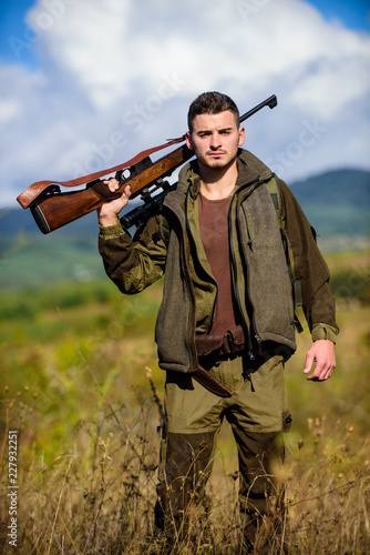 Hunting season. Hunting weapon gun or rifle. Man hunter carry rifle nature background. Experience and practice lends success hunting. Guy hunting nature environment. Masculine hobby activity