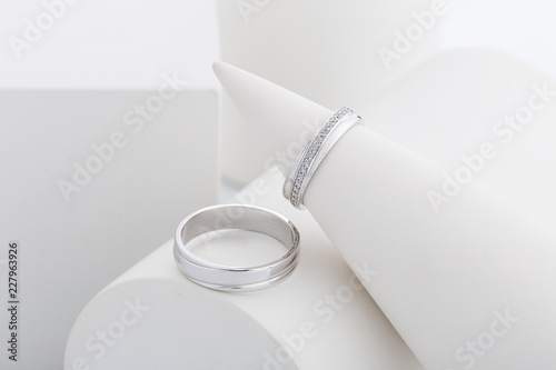 Pair of white gold wedding rings with diamonds in womens ring