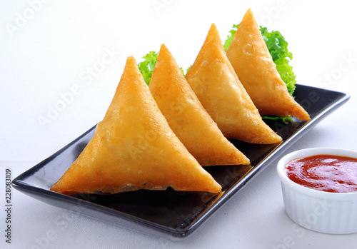 Samosa, Sambusa, Samboksa with a savory filling of chicken, mince, potato & vegetables