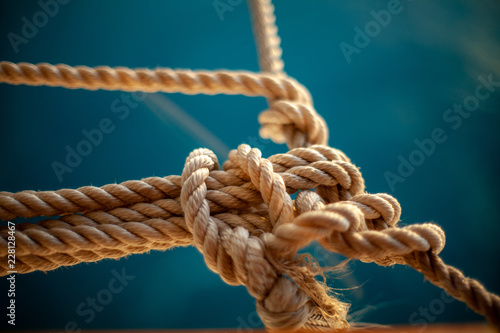 rope with knot on wooden background