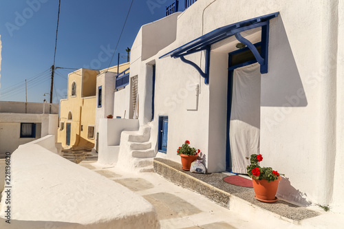 Traditional greek street with flowers in Amorgos island