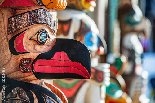 Alaska totem pole carving art sculture store in tourist travel attraction town on Alaska cruise. Ketchikan, Juneau, Skagway stores and shops selling native paintings and art.