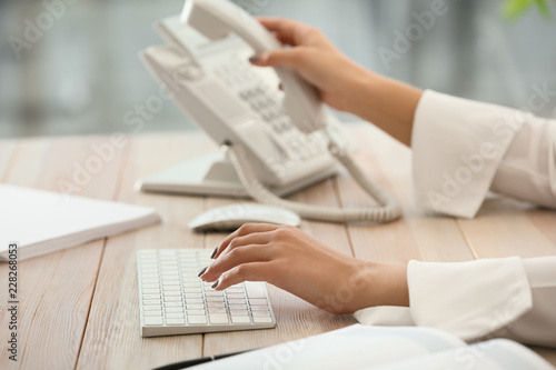 Female secretary working in office