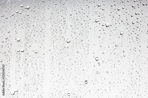 gray wet background / raindrops to overlay on the window, weather, background drops of water rain on the glass transparent