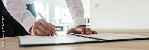 Businessman signing important document