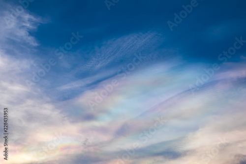 Colorful iridescent blue sky with cloud
