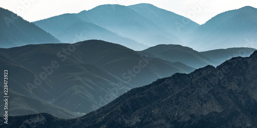 Vast mountain ridge in Ontario California in haze