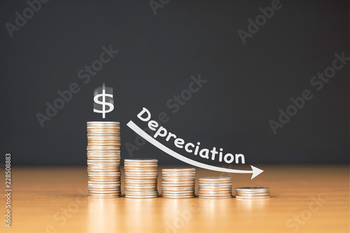 STACKED US QUARTER COINS ON WOODEN TABLE WITH WHITE ILLUSTRATION SHOWS DEPRECIATION IN US DOLLAR VALUE / FINANCIAL CONCEPT