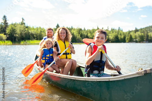 Family in a Canoe on a Lake having fun