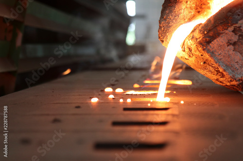 Casting iron by green sand process ; technology for Casting, in the metal industry, the process that molten metal is poured into a mold , where it solidifies into shape , Industrial background