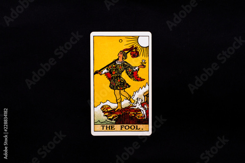 An individual major arcana tarot card isolated on black background. The Fool. 