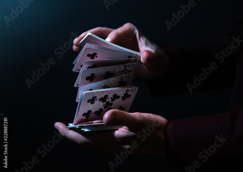 magician hands with playing cards