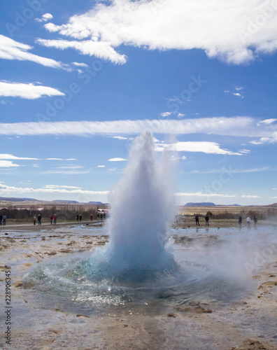 Strokkur geyser beginning to bubble up into an eruption in the golden circle in Iceland